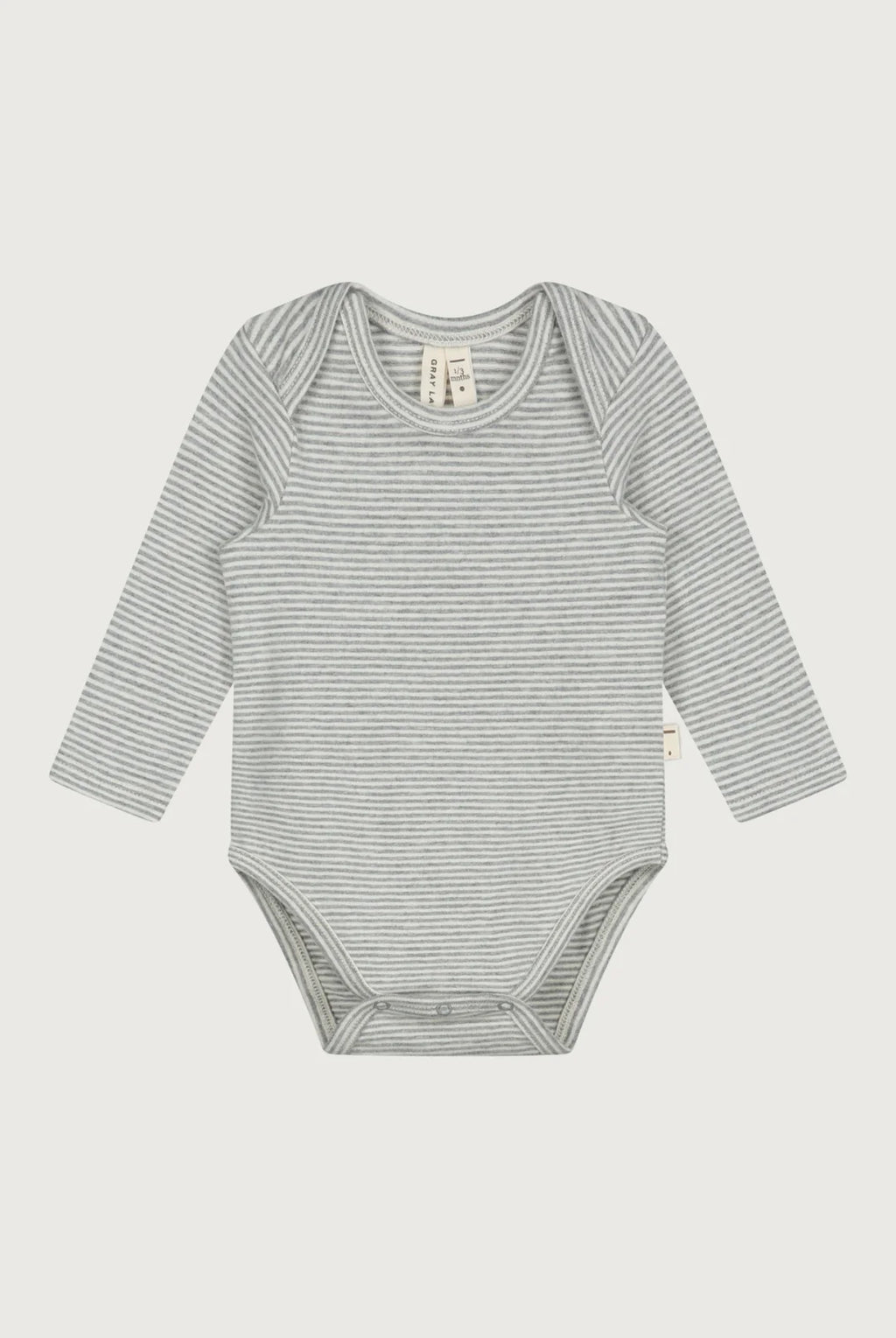 A long-sleeve baby bodysuit with fine horizontal gray and white stripes, laid flat against a light gray background.