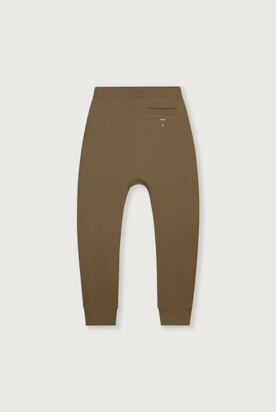 A pair of relaxed-fit jogger pants in a solid brown color, shown from the back on a light gray background.