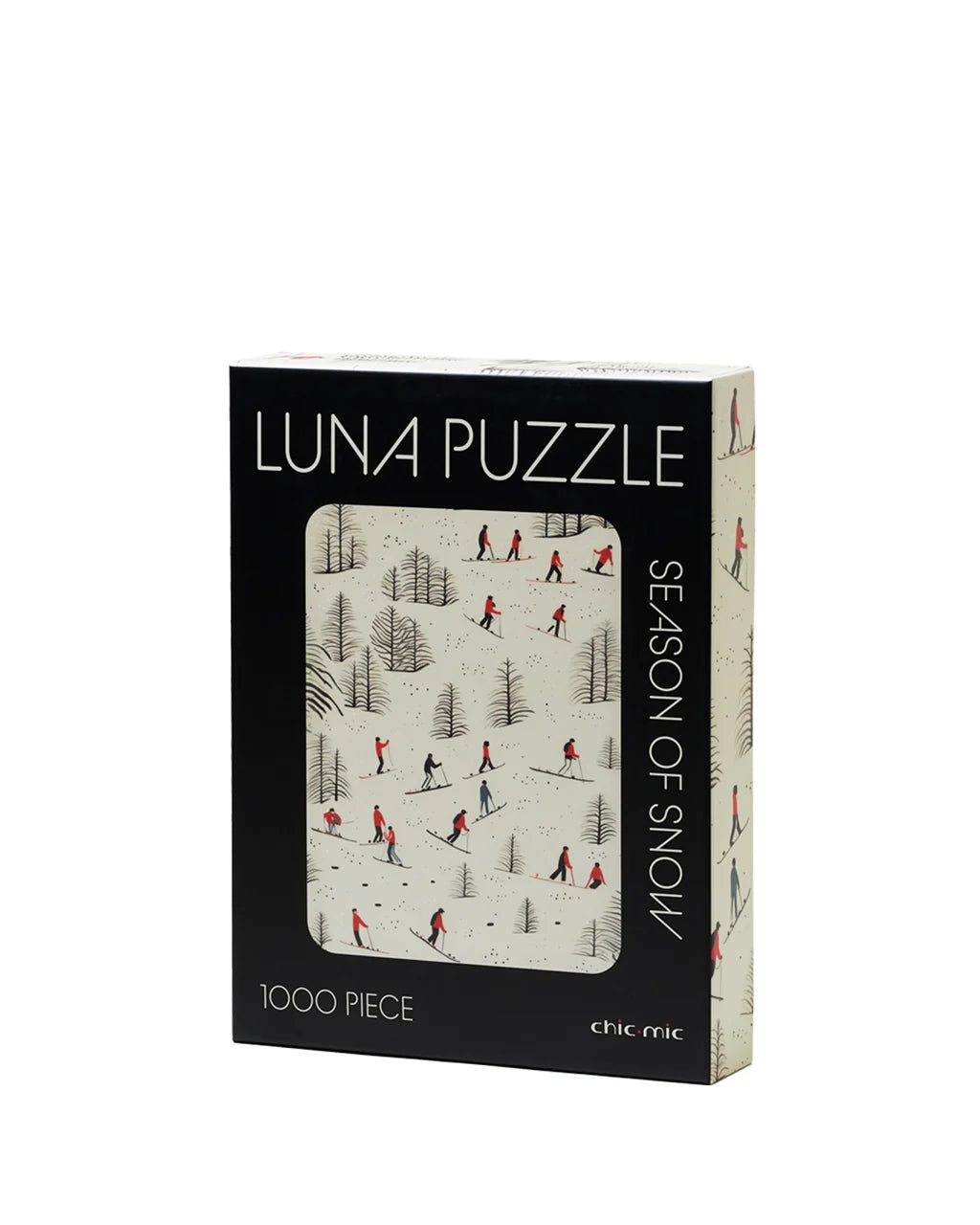 A 1000-piece jigsaw puzzle box titled 'LUNA PUZZLE' by the brand chic chic, featuring a winter scene illustration of skiers on a snowy hill. The box is black on the front with a large window showing the puzzle design, and has a cream-colored spine.