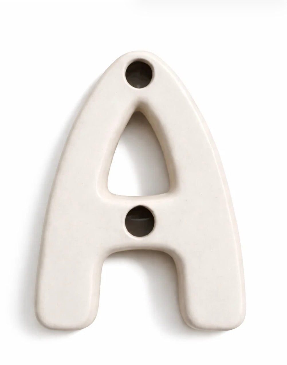 An uppercase letter 'A' wall sign made of matte ceramic, featuring two circular cutouts, shown on a clean white background.