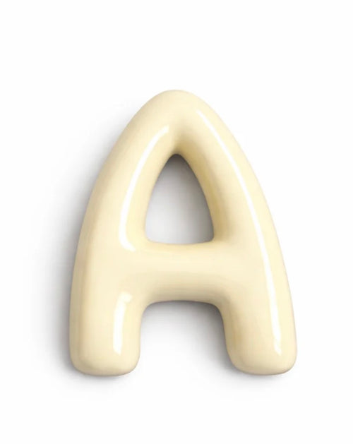 A glossy, 3D decorative letter 'A' in a warm cream or ivory color, shown on a plain white background.