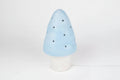A mushroom-shaped decorative lamp or figurine in light blue with small black dots and the text 'harlekijn import b.v.