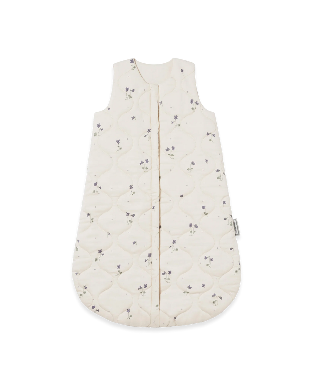 An off-white quilted baby sleep sack with a small purple floral pattern, featuring a front zipper closure and a side tag.