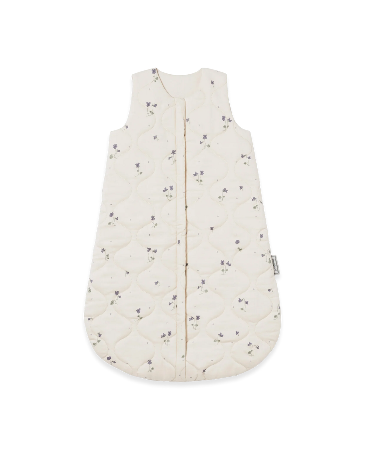 An off-white quilted baby sleep sack with a small purple floral pattern, featuring a front zipper closure and a side tag.