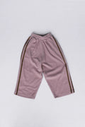 A pair of dusty pink cropped sweatpants with dark brown stripes down the sides, laid flat on a light gray background.