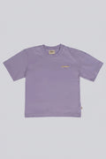 A light purple short-sleeve crewneck t-shirt with a small yellow wavy line graphic on the left chest, displayed flat against a solid gray background.