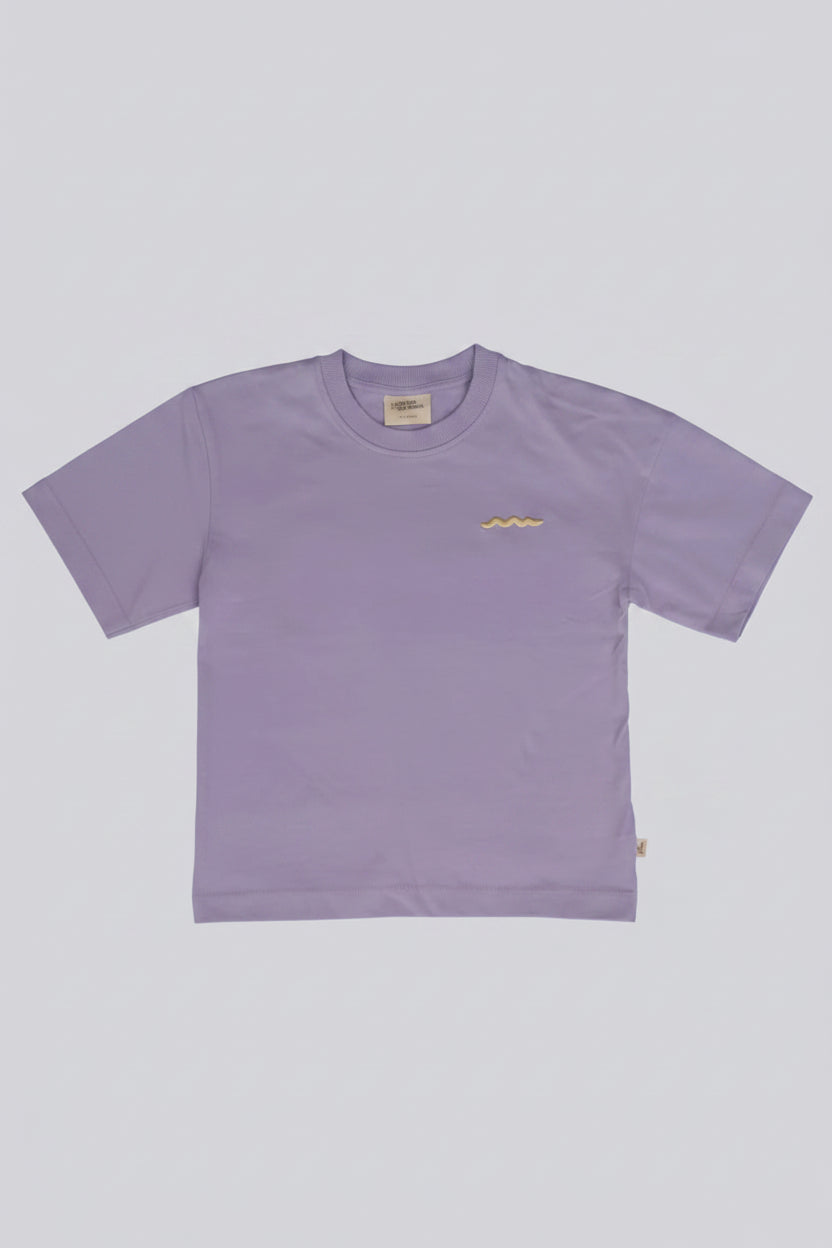 A light purple short-sleeve crewneck t-shirt with a small yellow wavy line graphic on the left chest, displayed flat against a solid gray background.