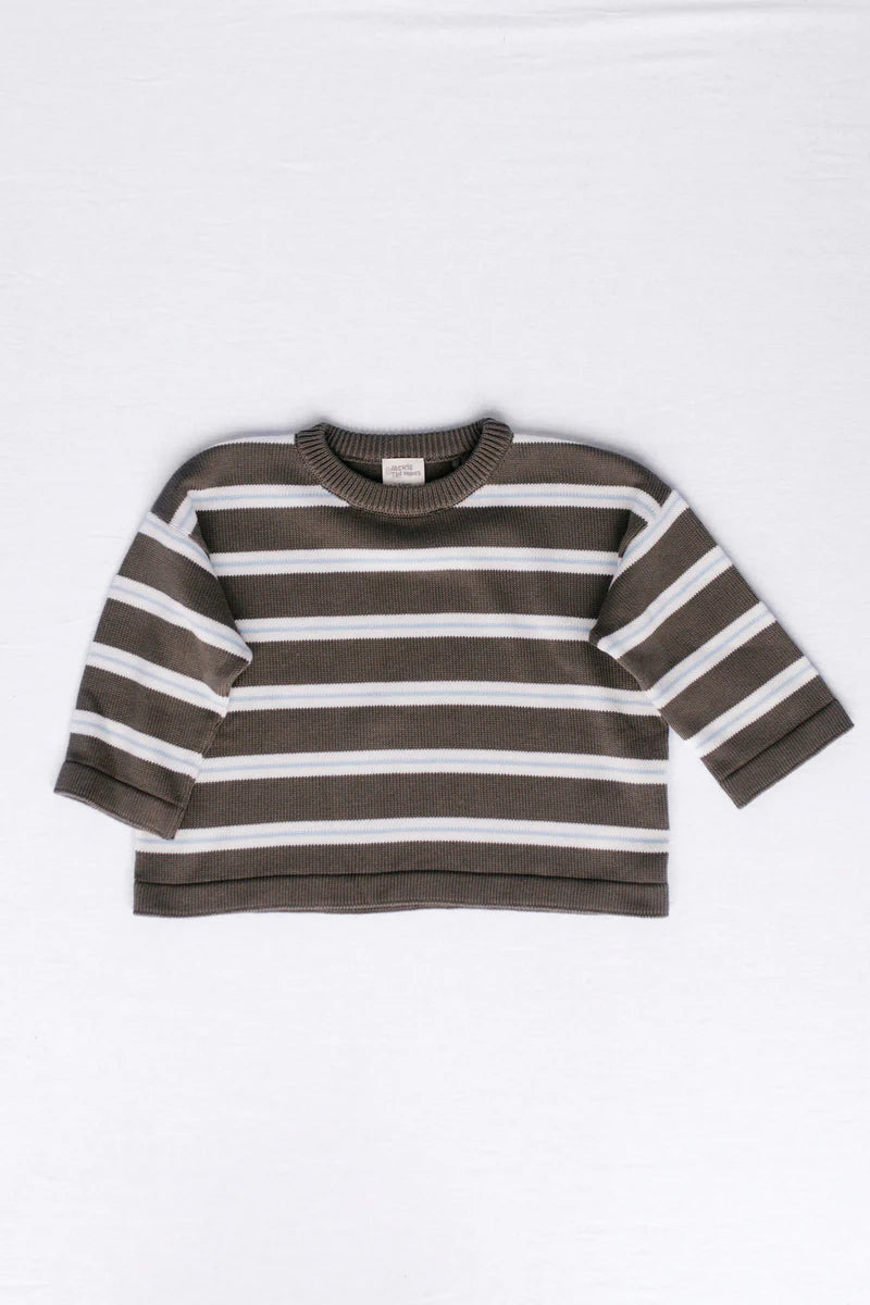 Brown and white striped sweater on a white background