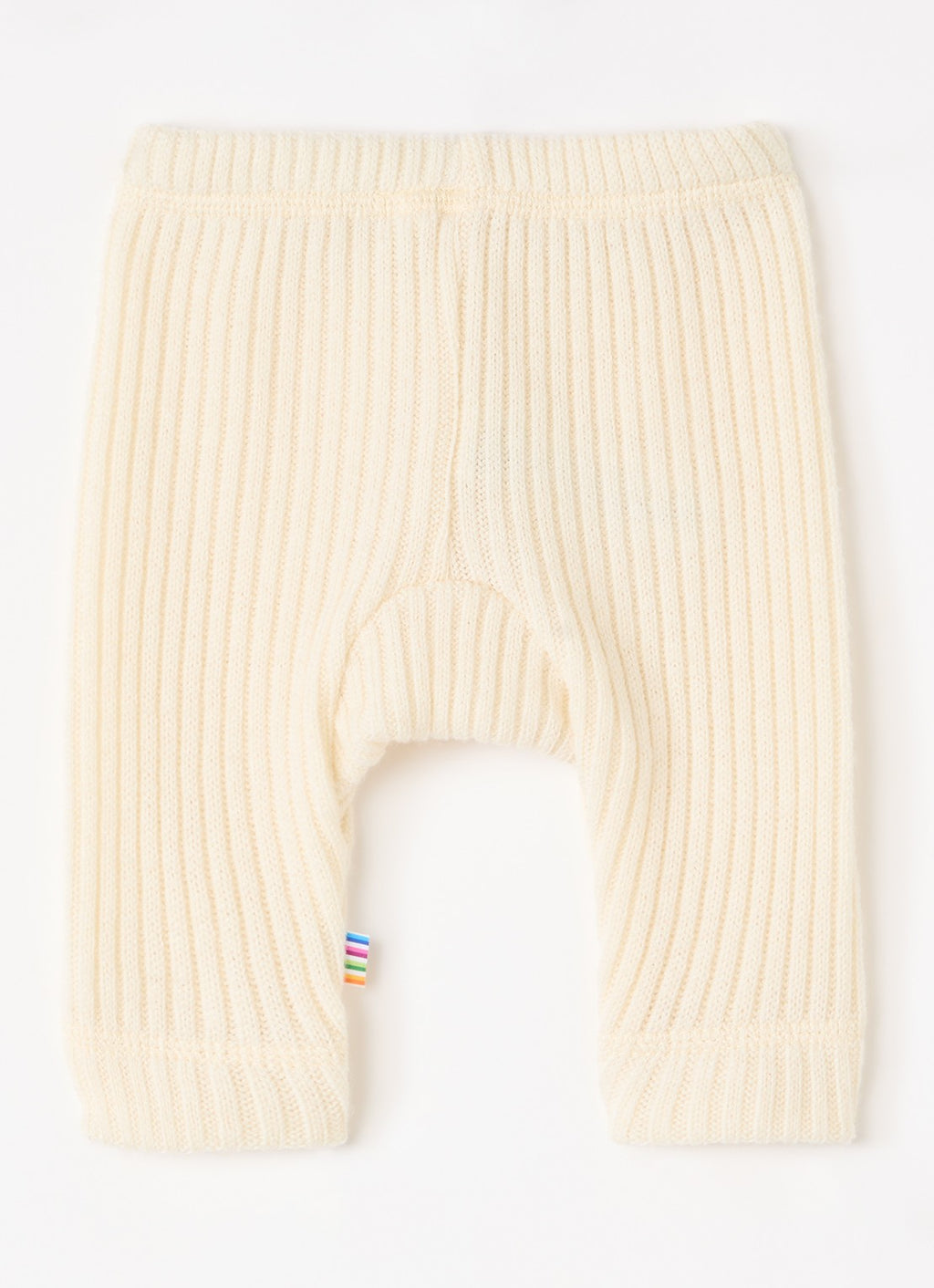 Cream ribbed knit baby leggings with a small colorful striped fabric tag near the lower left leg, shown flat on a white background.
