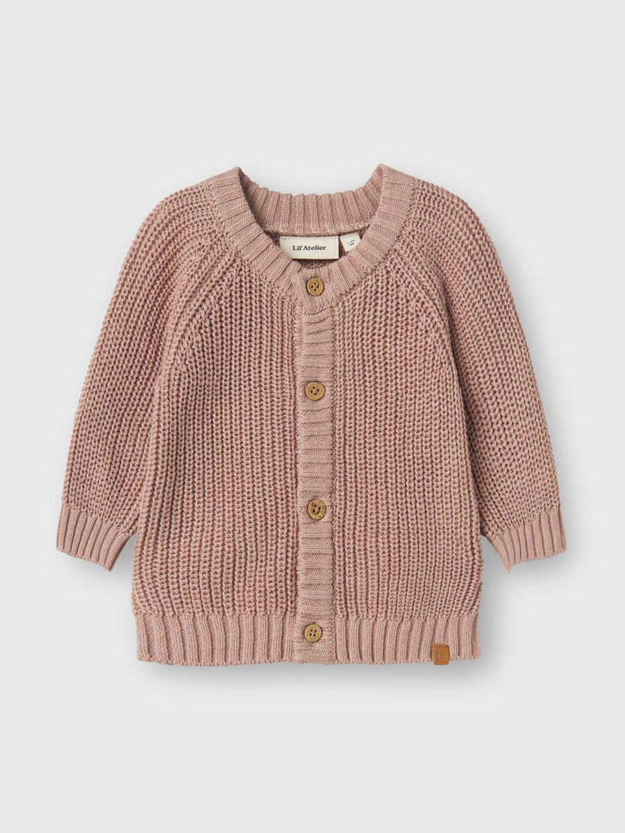 A dusty pink chunky knit cardigan sweater for toddlers, featuring a round neckline, raglan sleeves, and brown wooden buttons, shown flat on a light gray background.