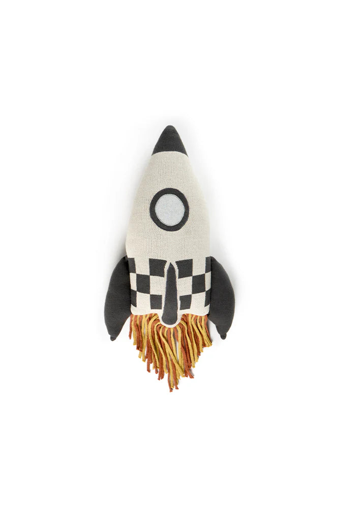Toy rocket ship cushion with a checkered pattern on a white background