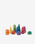 A set of colorful, organic-shaped wooden stacking toys arranged on a plain light gray background.