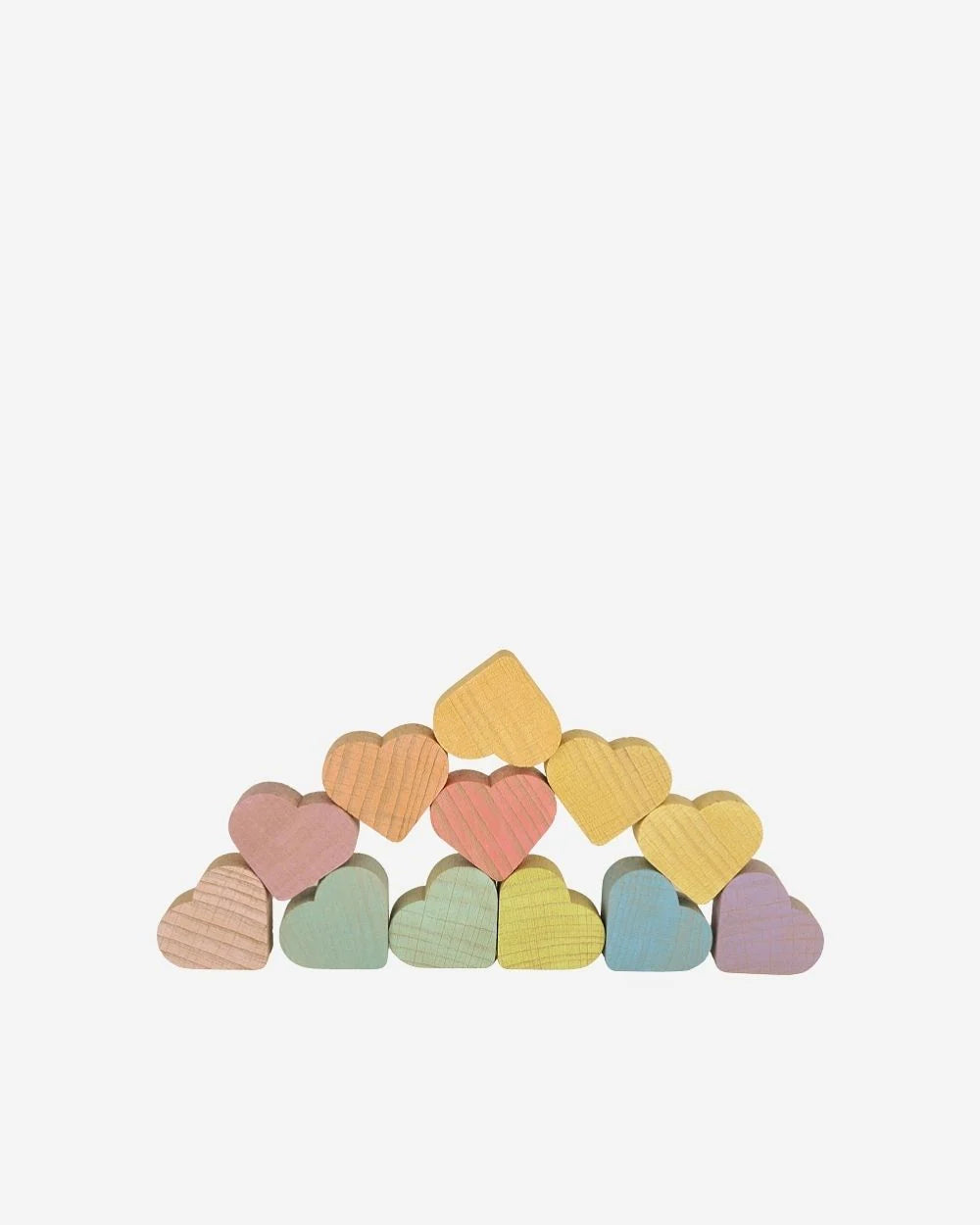 A set of small wooden heart-shaped blocks in pastel colors, stacked in a low arch on a plain light gray background.