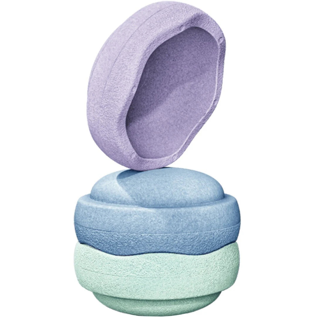 Three textured fabric bath or shower poultions stacked vertically, with the top lavender poultion slightly offset above the others, shown on a plain white background.