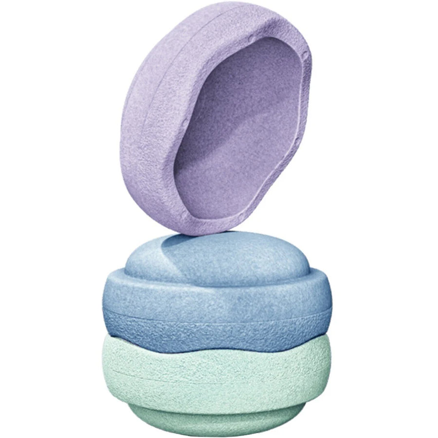 Three textured fabric bath or shower poultions stacked vertically, with the top lavender poultion slightly offset above the others, shown on a plain white background.