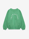 A green crewneck sweatshirt with 'TRUE ARTIST' printed in white arched text across the chest, displayed on a clean white background.
