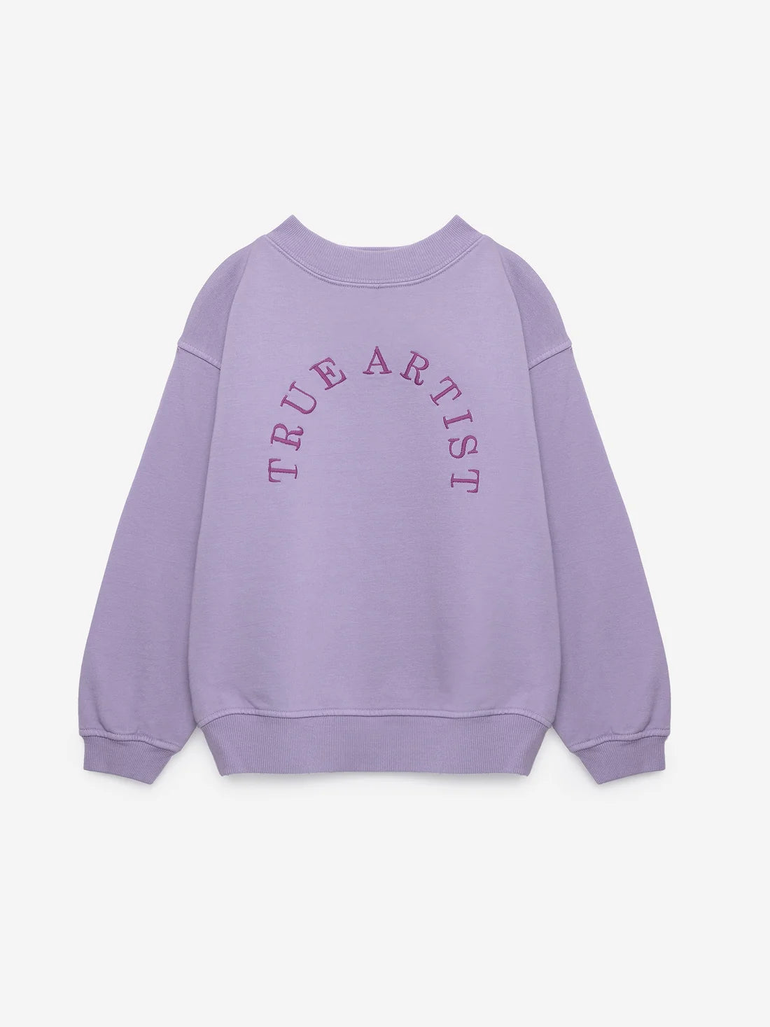 A light purple crewneck sweatshirt with 'TRUE ARTIST' printed in a matching purple arched font across the chest, displayed on a clean off-white background.
