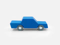 Blue toy truck on a light gray background