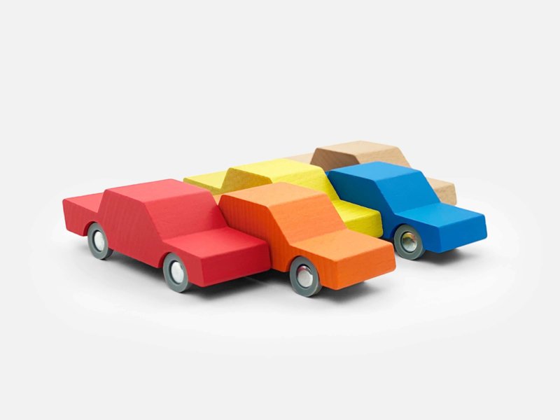 four cars in differnet colours from way to play white background