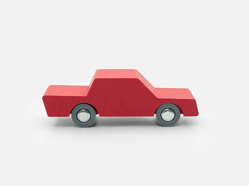 Red toy truck on a white background