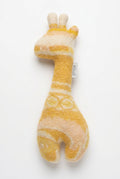 A yellow and cream felt giraffe toy with a small white fabric tag that reads 'VOLLO', photographed on a clean white background.