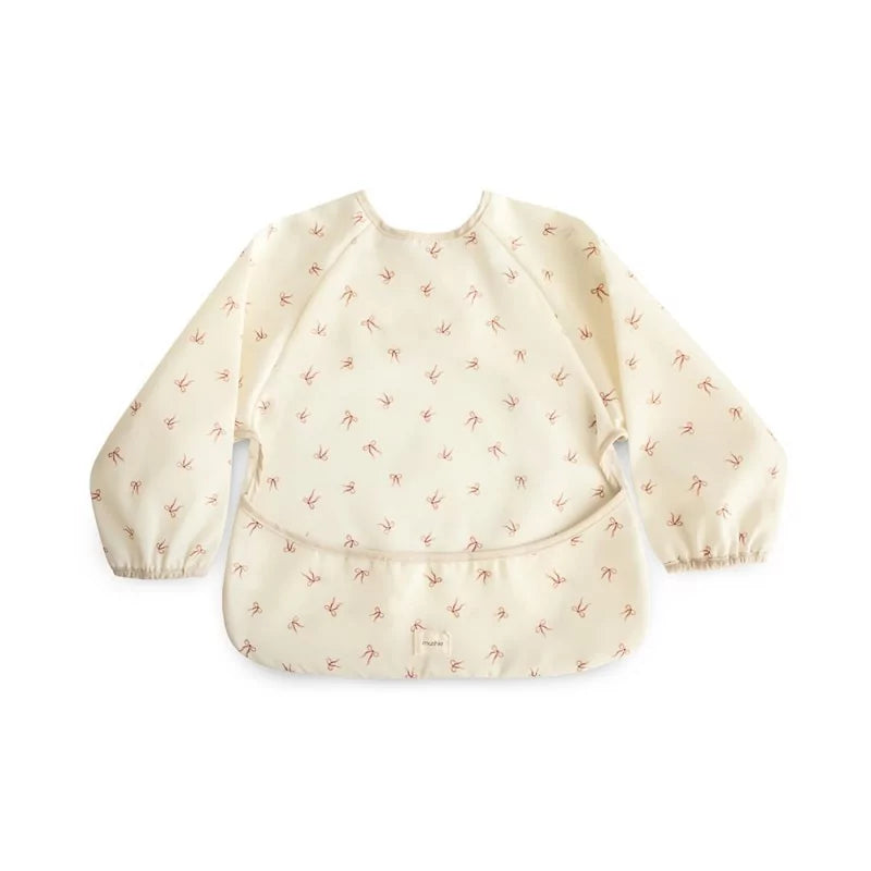 Beige baby bib with small pattern on a white background