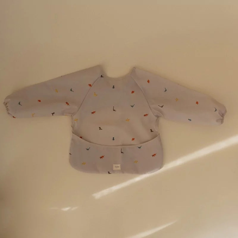 Children's long-sleeve shirt with Dino-pattern on a beige background