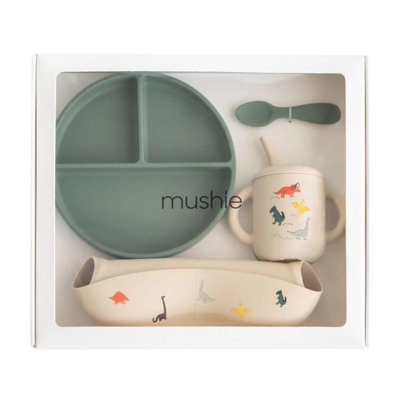 Children's dining set with plate, cup, and spoon in packaging, featuring the brand 'mushie'.