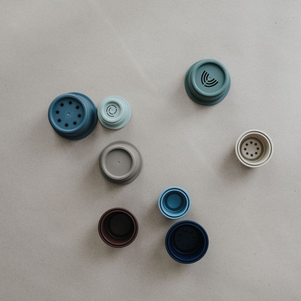 Collection of various bottle caps on a light gray background